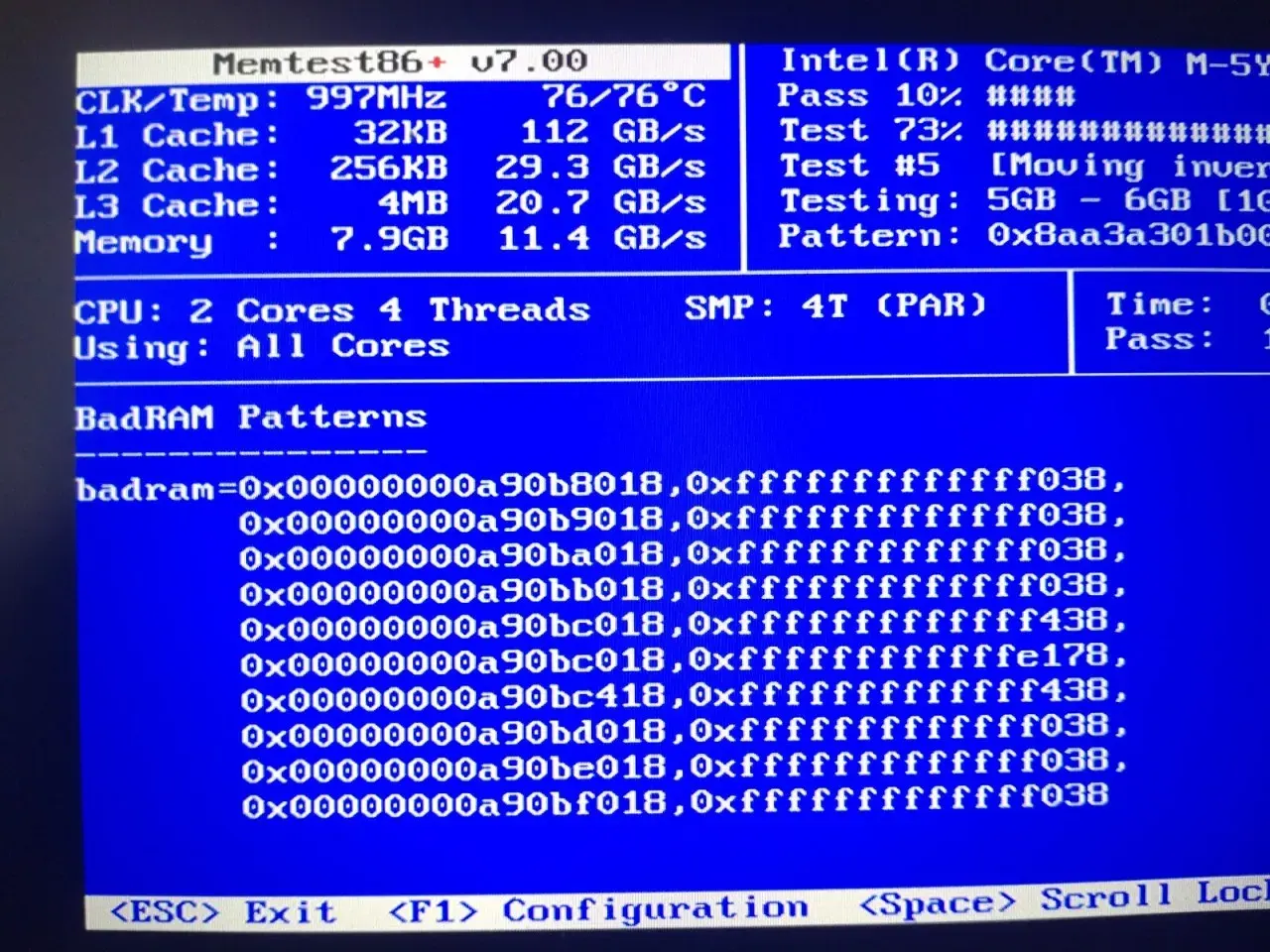 a camera photo of a laptop display showing a failing memtest86+ 